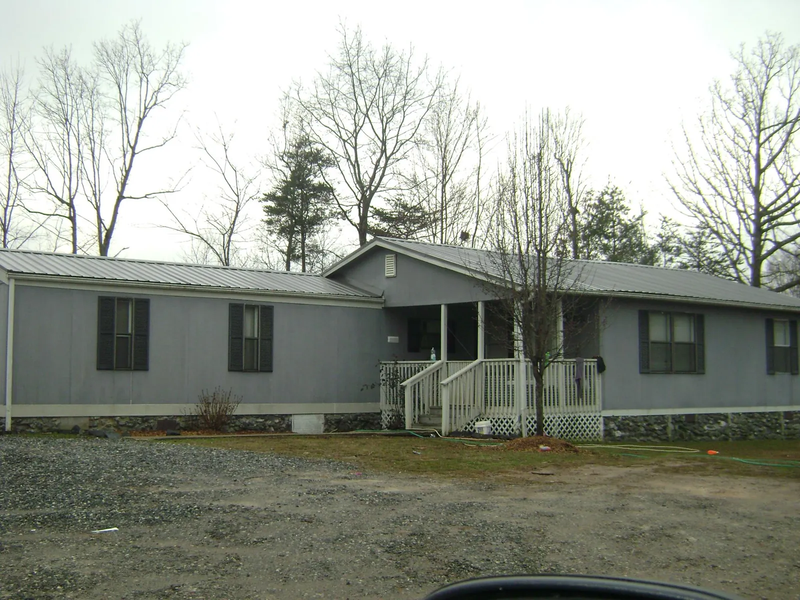 Metal roof over a manufactured home with a covered front porch in Bennington